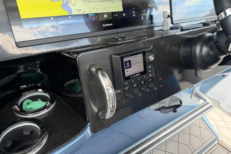Slide: The Image of Dashboard of 2022 Nor-Tech 340 Sport with Garmin navigation and JL Audio system. - 19