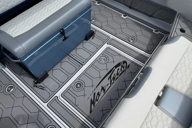 Slide: The Image of 2022 Nor-Tech 340 Sport boat interior with custom flooring and seating. - 17