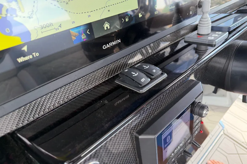 Slide: The Image of Dashboard of a 2022 Nor-Tech 340 Sport featuring Garmin navigation and control buttons. - 20