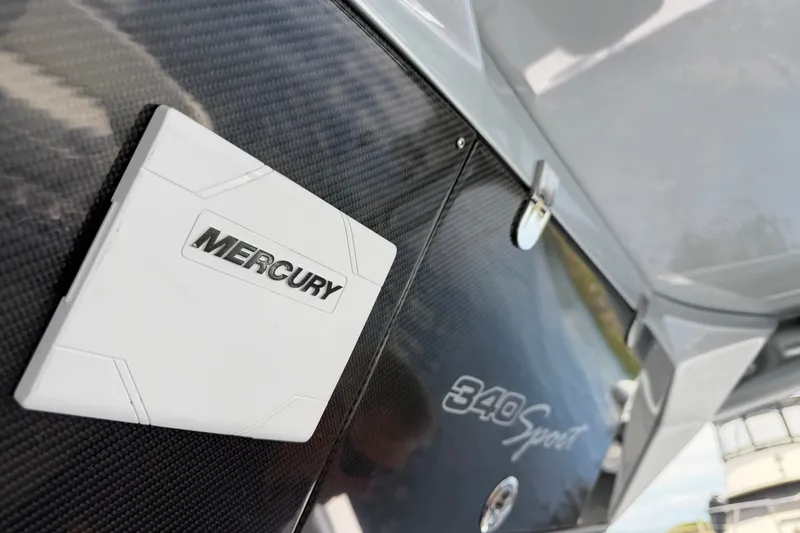 Slide: The Image of Close-up of 2022 Nor-Tech 340 Sport boat with Mercury branding. - 22