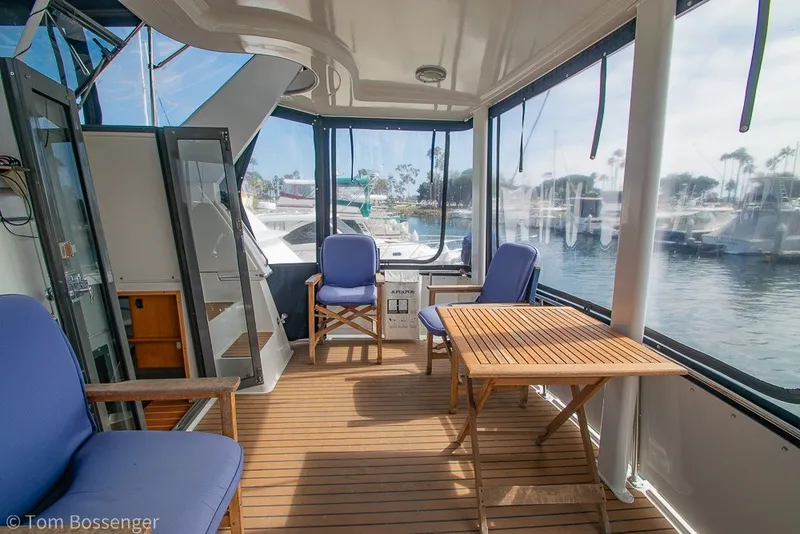 Slide: The Image of Interior of 1994 Carver 370 Aft Cabin Motor Yacht with seating and table. - 33