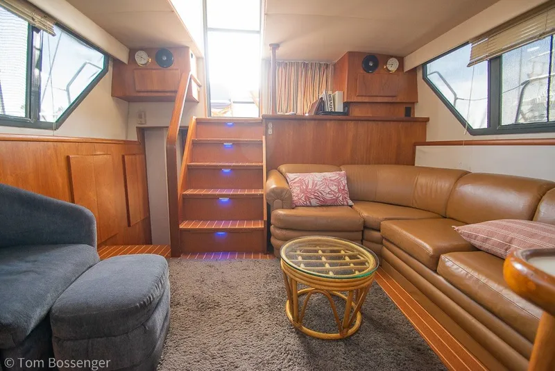 Slide: The Image of Luxurious interior of 1994 Carver 370 Aft Cabin Motor Yacht with cozy seating and elegant decor. - 11