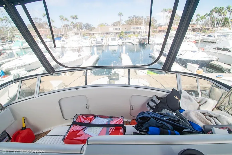 Slide: The Image of 1994 Carver 370 Aft Cabin Motor Yacht interior with marina view and boating gear. - 39