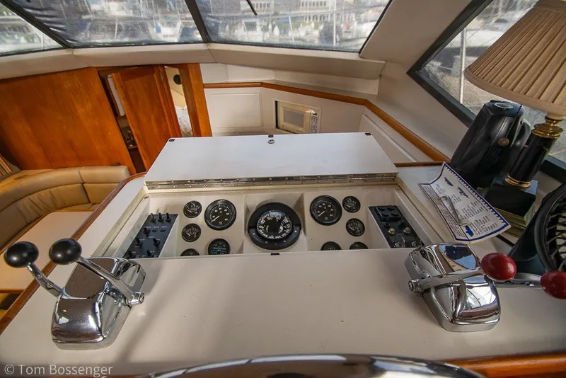 Slide: The Image of 1994 Carver 370 Aft Cabin Motor Yacht helm with gauges and controls. - 45
