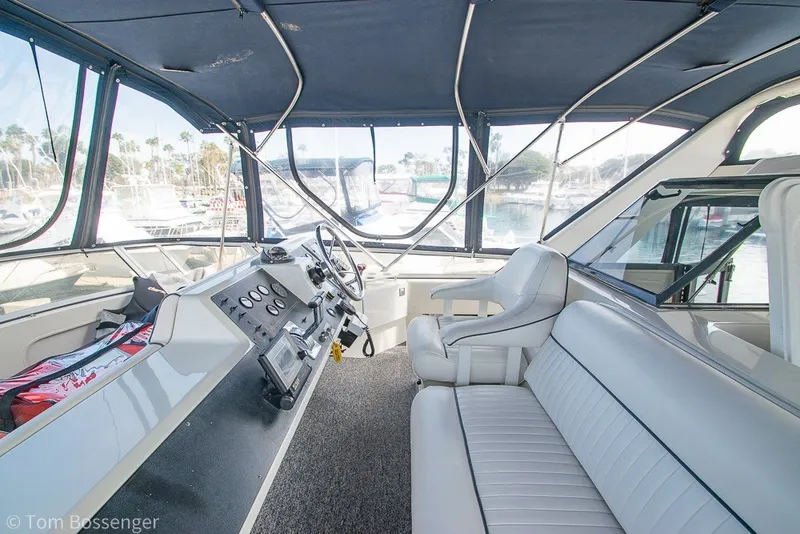 Slide: The Image of Interior of 1994 Carver 370 Aft Cabin Motor Yacht with helm and seating area. - 36