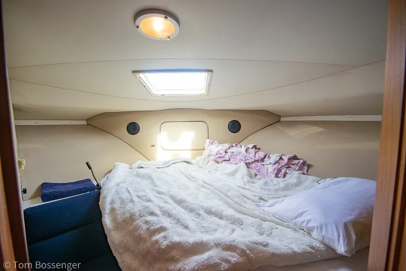 Slide: The Image of Cozy cabin interior of 1994 Carver 370 Aft Cabin Motor Yacht with bed and skylight. - 28