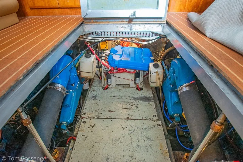 Slide: The Image of Engine room of 1994 Carver 370 Aft Cabin Motor Yacht with visible blue engines. - 47