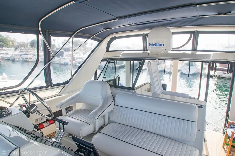 Slide: The Image of 1994 Carver 370 Aft Cabin Motor Yacht interior with helm and seating area. - 37