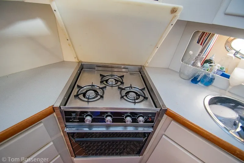 Slide: The Image of 1994 Carver 370 Aft Cabin Motor Yacht kitchen with stove and sink. - 20