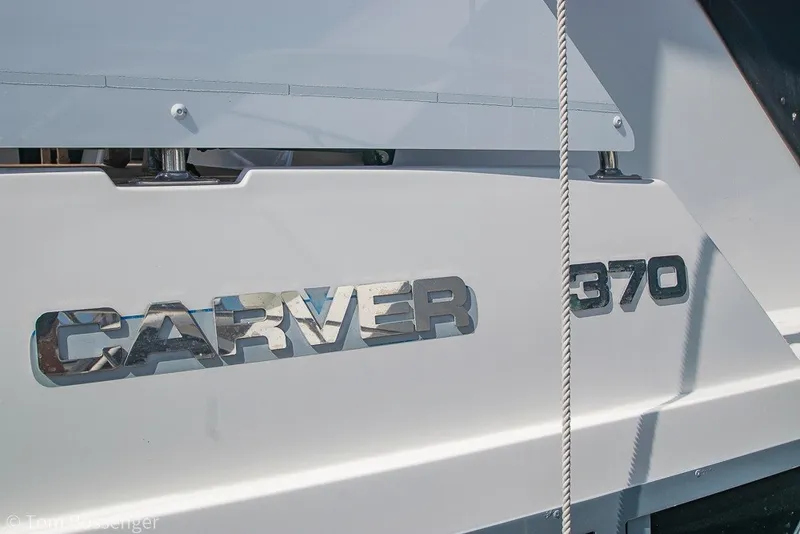 Slide: The Image of Close-up of 1994 Carver 370 Aft Cabin Motor Yacht nameplate on the hull. - 4