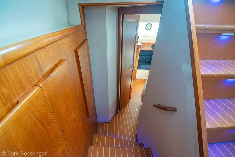 Slide: The Image of Interior of 1994 Carver 370 Aft Cabin Motor Yacht with wooden stairs and cabin view. - 22