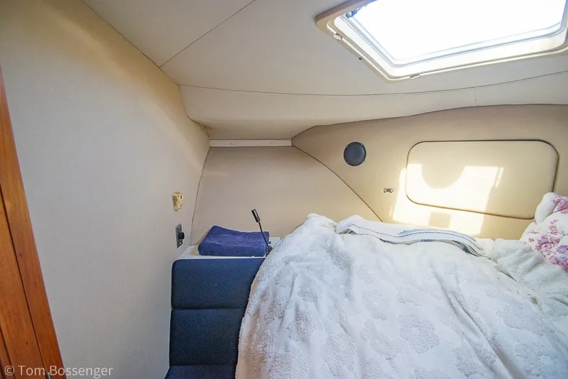 Slide: The Image of Cozy cabin interior of 1994 Carver 370 Aft Cabin Motor Yacht with skylight. - 29