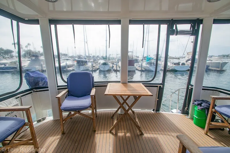 Slide: The Image of Interior view of 1994 Carver 370 Aft Cabin Motor Yacht with marina backdrop. - 32