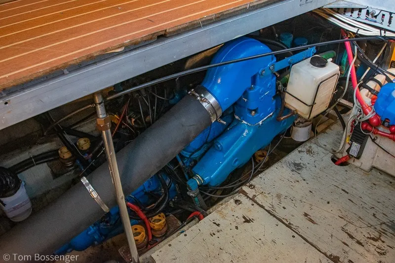 Slide: The Image of Engine compartment of a 1994 Carver 370 Aft Cabin Motor Yacht, showcasing mechanical components. - 49