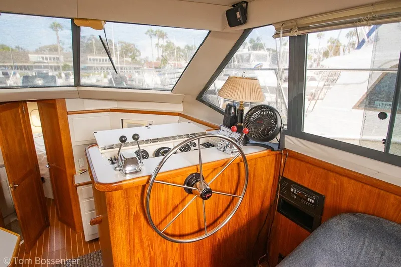 Slide: The Image of Interior helm of 1994 Carver 370 Aft Cabin Motor Yacht with steering wheel and controls. - 44