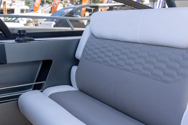 Slide: The Image of Luxurious interior seating of 2026 Valiatt 350GT with hexagonal pattern design. - 10