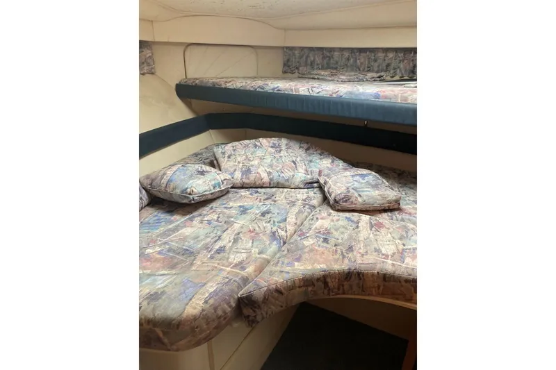 Slide: The Image of 1996 Carver 355 Aft Cabin Motor Yacht interior with patterned bedding. - 18
