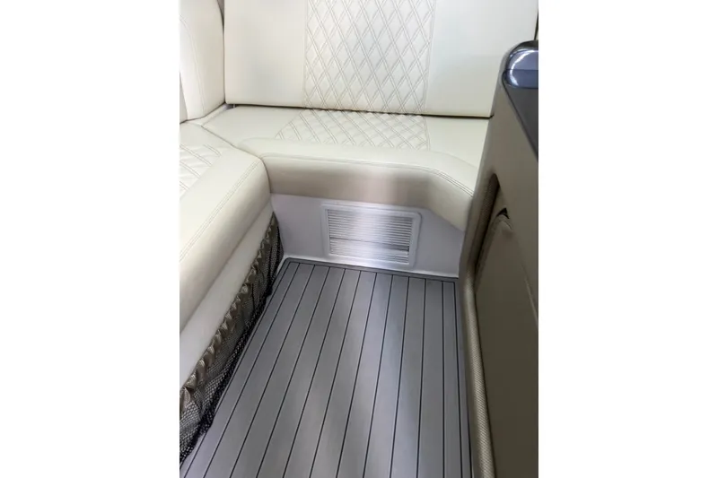 Slide: The Image of Luxurious 2020 Nor-Tech boat interior with cream leather seating and sleek flooring. - 22