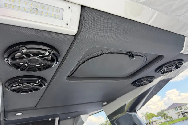 Slide: The Image of 2020 Nor-Tech boat interior with speakers and LED lighting on the ceiling. - 36