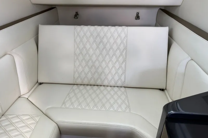 Slide: The Image of Luxurious white leather seating in a 2020 Nor-Tech boat interior. - 23