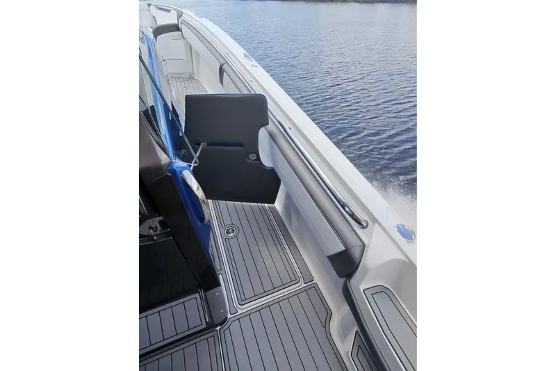Slide: The Image of 2020 Nor-Tech boat deck with open door, sleek design, and water view. - 38