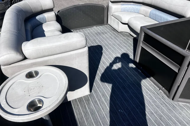 Slide: The Image of Luxurious seating area on 2022 Premier Escalante boat with shadow on striped flooring. - 28