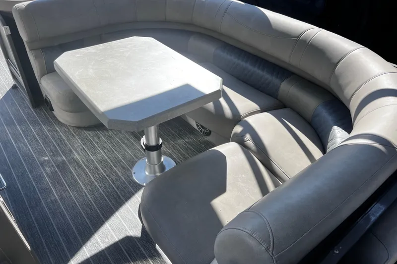 Slide: The Image of Luxurious seating area in 2022 Premier Escalante with modern table and sleek design. - 21