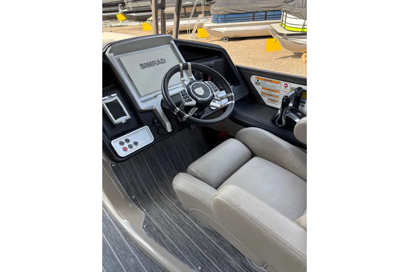 Slide: The Image of 2022 Premier Escalante boat cockpit with Simrad display and comfortable seating. - 29