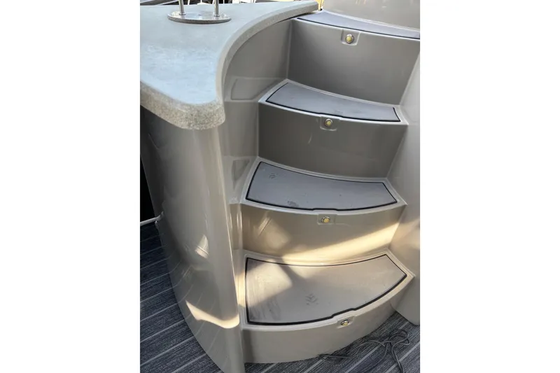 Slide: The Image of 2022 Premier Escalante boat interior steps with non-slip surface and modern design. - 32