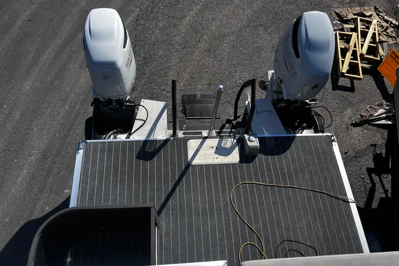 Slide: The Image of Top view of 2022 Premier Escalante boat with dual outboard motors. - 25