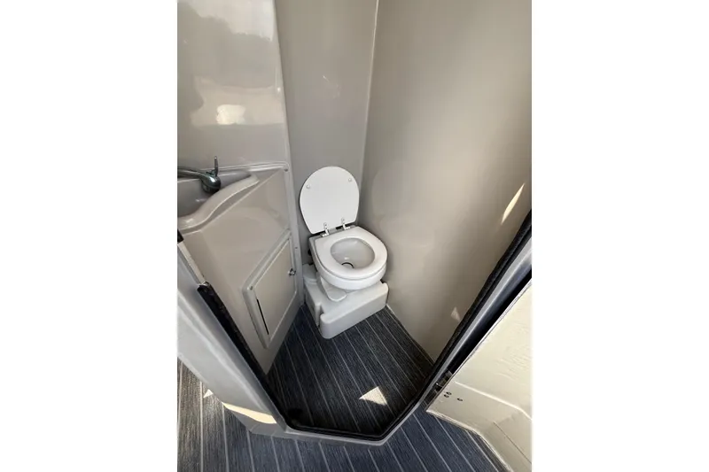 Slide: The Image of Compact bathroom in 2022 Premier Escalante RV with toilet and sink. - 30