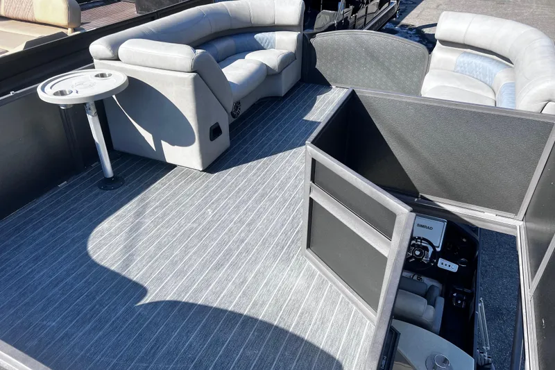 Slide: The Image of 2022 Premier Escalante boat interior with gray seating and control panel. - 23