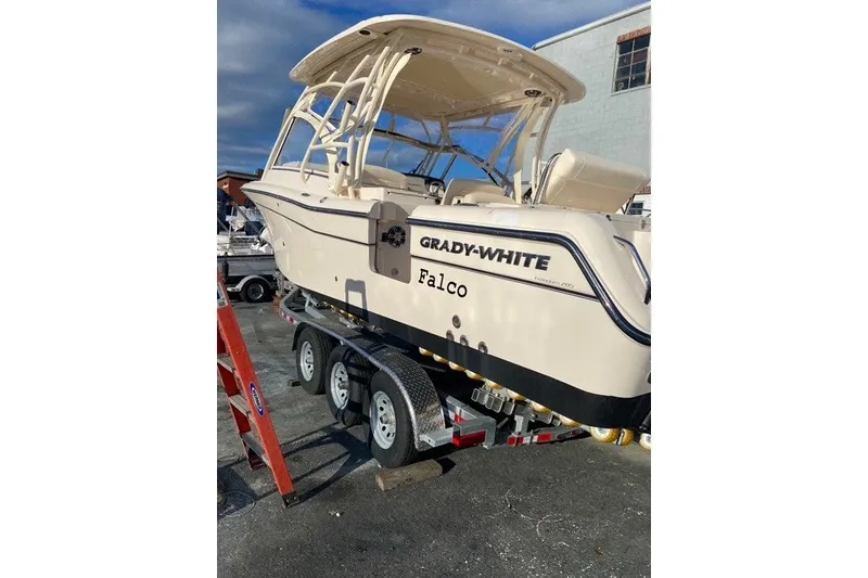 The Image of 2022 Grady-White Freedom 285 boat on trailer, outdoor setting. - 0
