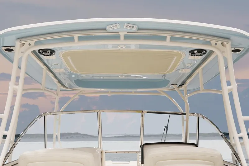 Slide: The Image of Manufacturer Provided Image: 2022 Grady-White Freedom 285 boat with a sleek hardtop and ocean backdrop. - 14