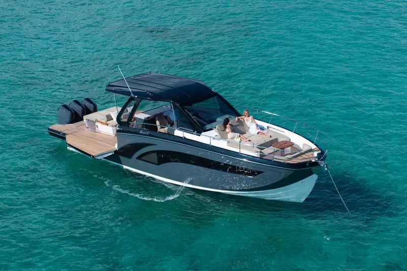 Slide: The Image of Luxury Hanover 447 boat cruising on clear turquoise waters, 2026 model. - 1