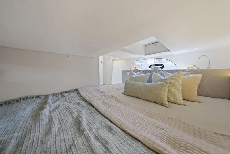 Slide: The Image of Luxurious cabin interior of 2025 Valiatt 380 Bowrider with cozy bedding and pillows. - 20