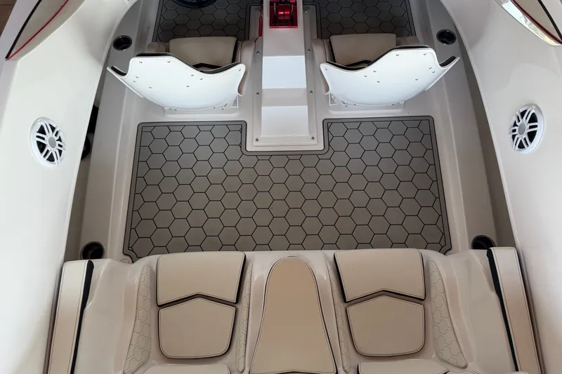 Slide: The Image of 2024 Trick 23 Widebody boat interior with hexagonal flooring and stylish seating. - 11