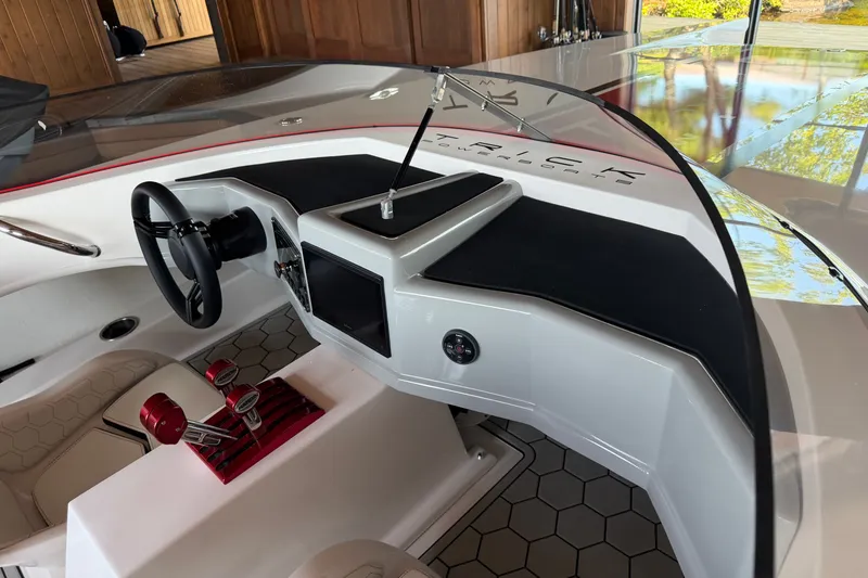 Slide: The Image of 2024 Trick 23 Widebody boat interior with sleek dashboard and modern controls. - 22