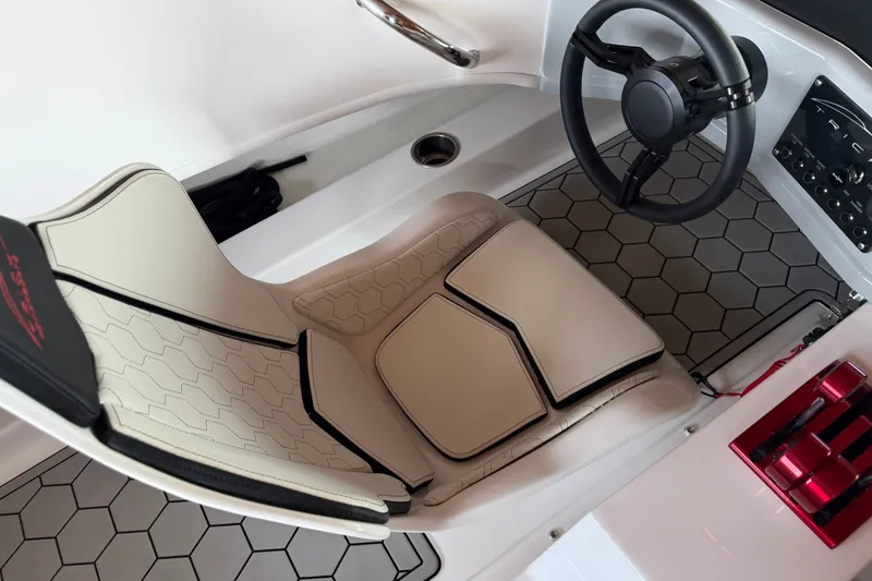 Slide: The Image of 2024 Trick 23 Widebody cockpit with hexagonal flooring and modern steering wheel design. - 15