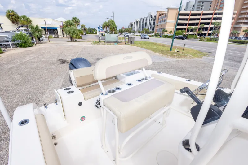 Slide: The Image of 2016 Cobia 201 Center Console boat interior with seating and steering wheel. - 41