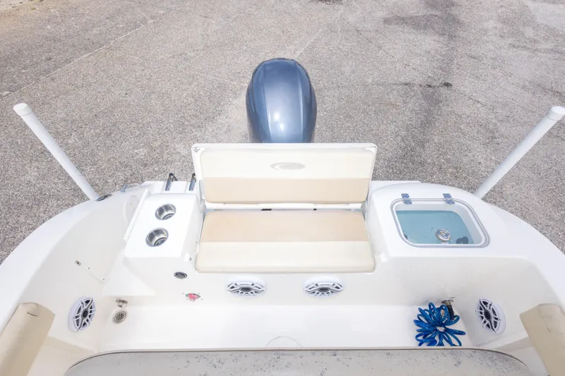 Slide: The Image of 2016 Cobia 201 Center Console boat interior with seating and storage compartments. - 42