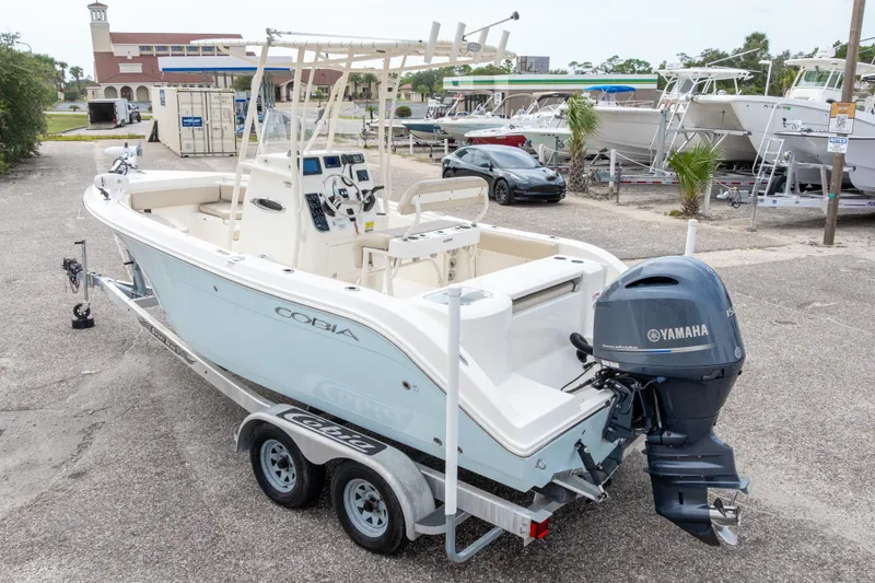 Slide: The Image of 2016 Cobia 201 Center Console boat with Yamaha engine on trailer. - 51