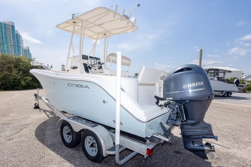 Slide: The Image of 2016 Cobia 201 Center Console boat with Yamaha engine on trailer. - 15