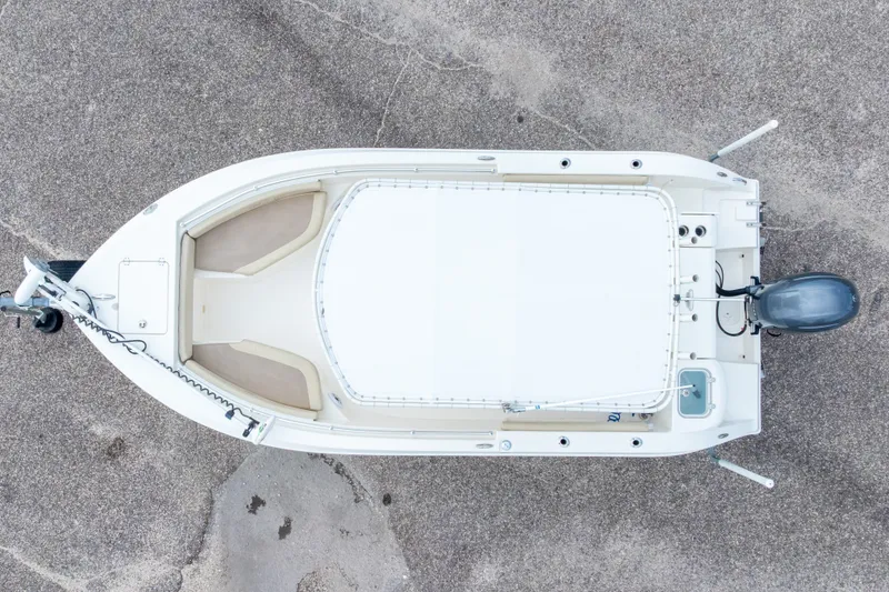 Slide: The Image of Overhead view of a 2016 Cobia 201 Center Console boat on pavement. - 6