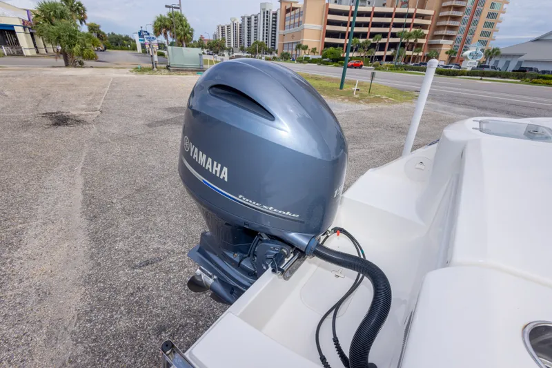 Slide: The Image of 2016 Cobia 201 Center Console with Yamaha outboard motor in urban setting. - 47