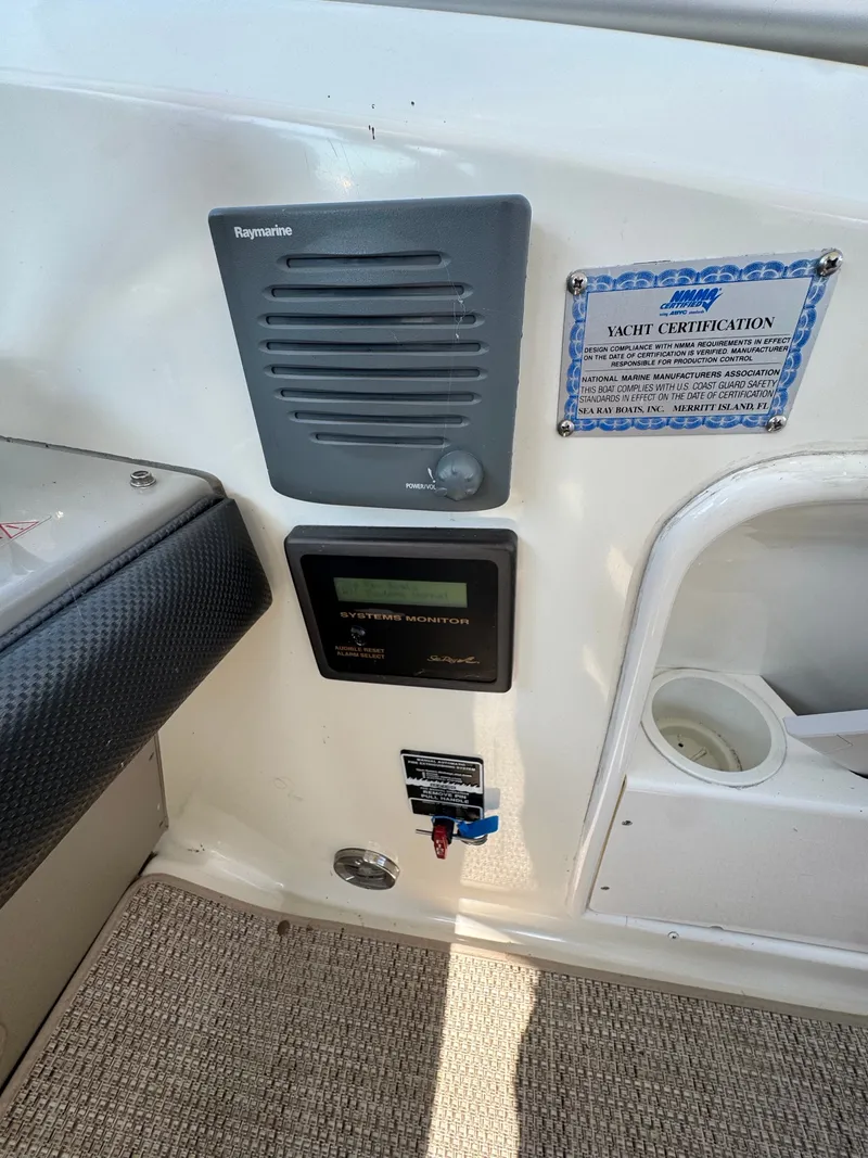 Slide: The Image of The image shows the dashboard of a 2005 Sea Ray 390 Sundancer with a Raymarine device. - 17