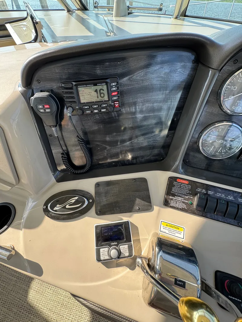 Slide: The Image of The image shows the dashboard of a 2005 Sea Ray 390 Sundancer with various instruments. - 14