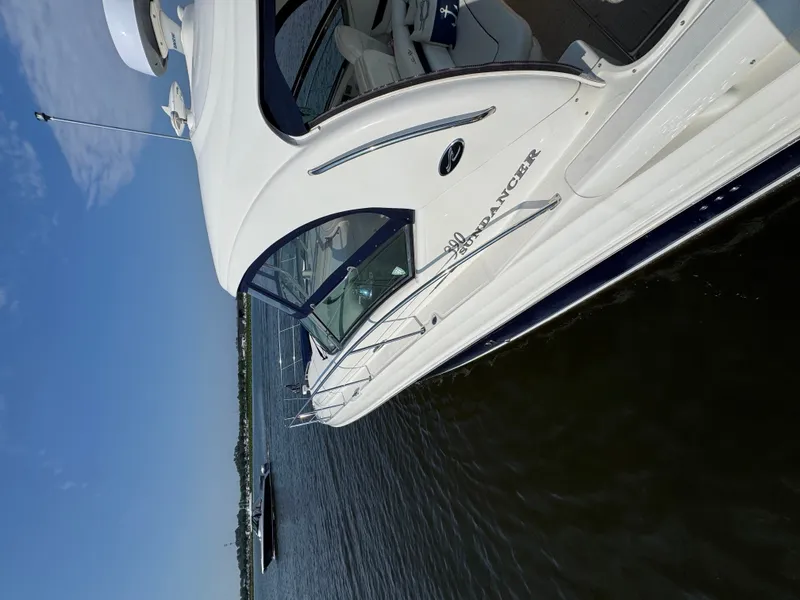 Slide: The Image of A 2005 Sea Ray 390 Sundancer on the water, featuring sleek design and spacious deck. - 7