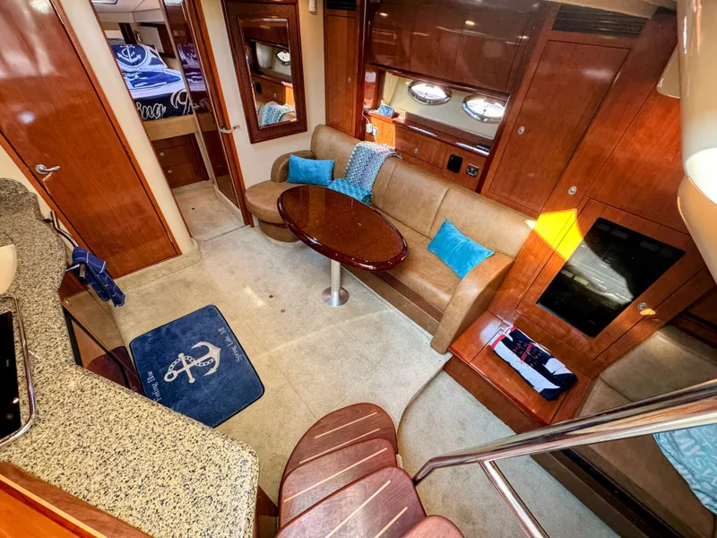 Slide: The Image of Interior of a 2005 Sea Ray 390 Sundancer with elegant wood finishes and comfortable seating. - 37