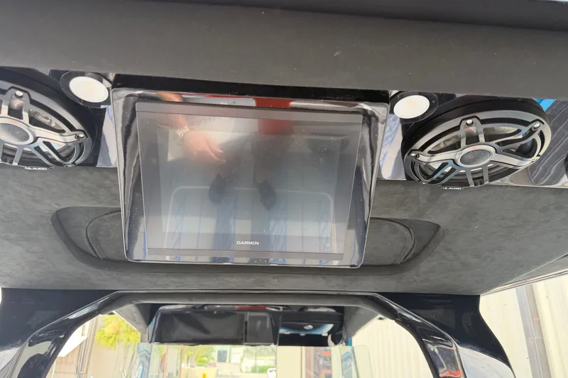 Slide: The Image of 2027 Nor-Tech boat dashboard with Garmin display and speakers. - 20